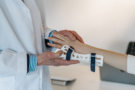 Doctor fitting a wrist brace on a patient — Oak Ridges Fracture Clinic